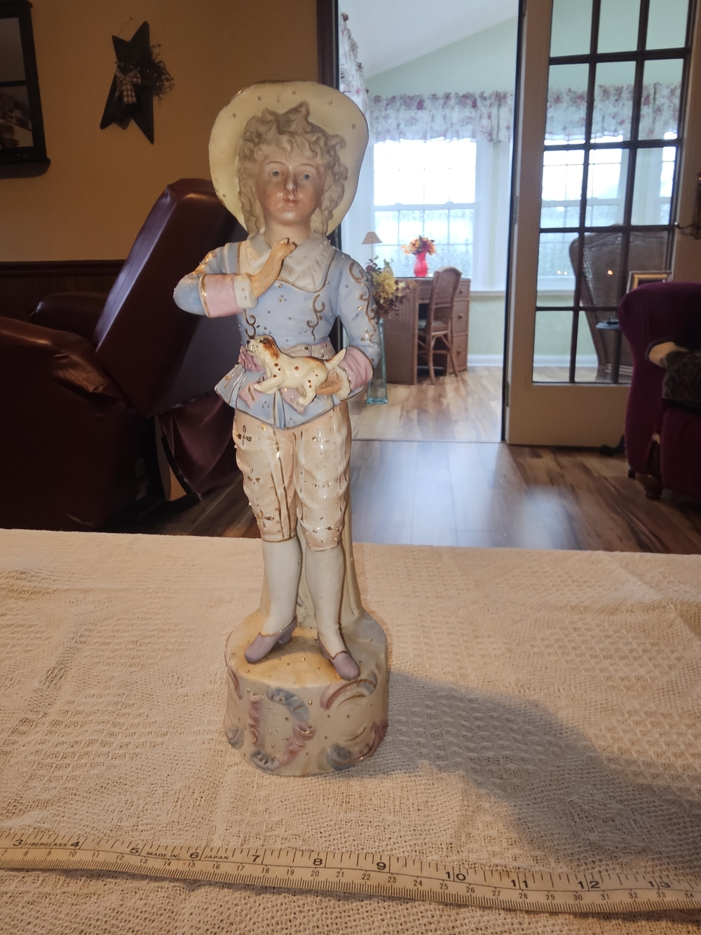 Vintage 13" Porcelain Figurine Featuring Young Dandy Holding Puppy